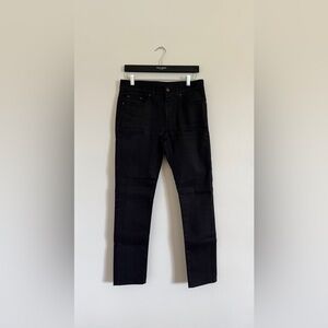 Black Saint Laurent jeans.